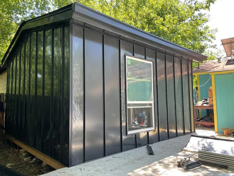 Black standing seam metal wall panels for Roof Inspection in Clyde